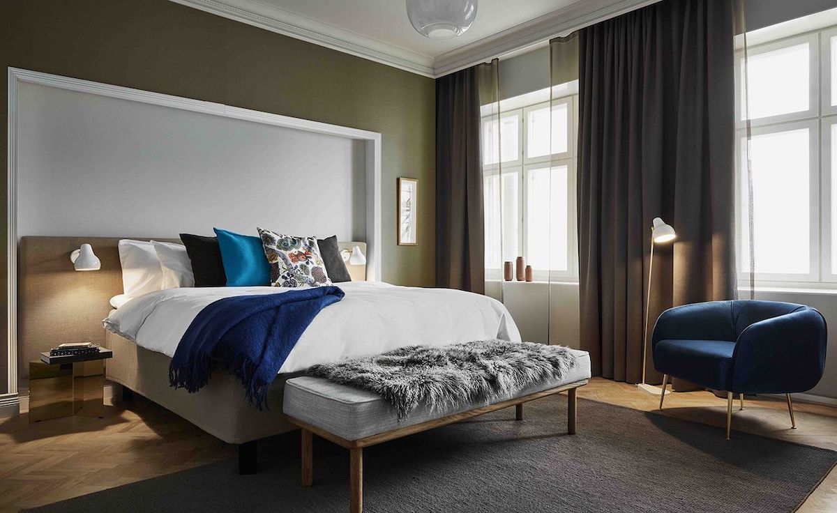 Plush bedroom inside Hotel George in Finland