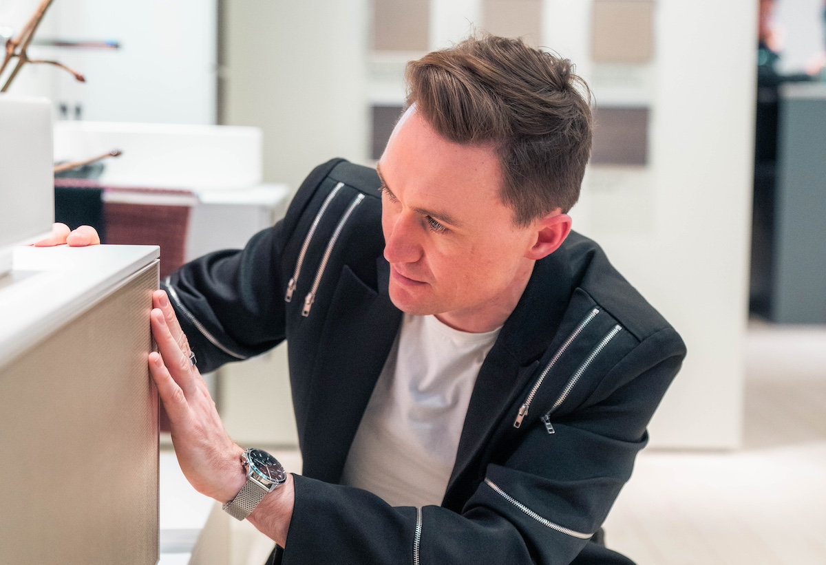 Hamish Kilburn exploring the bathroom furniture at ISH 2025