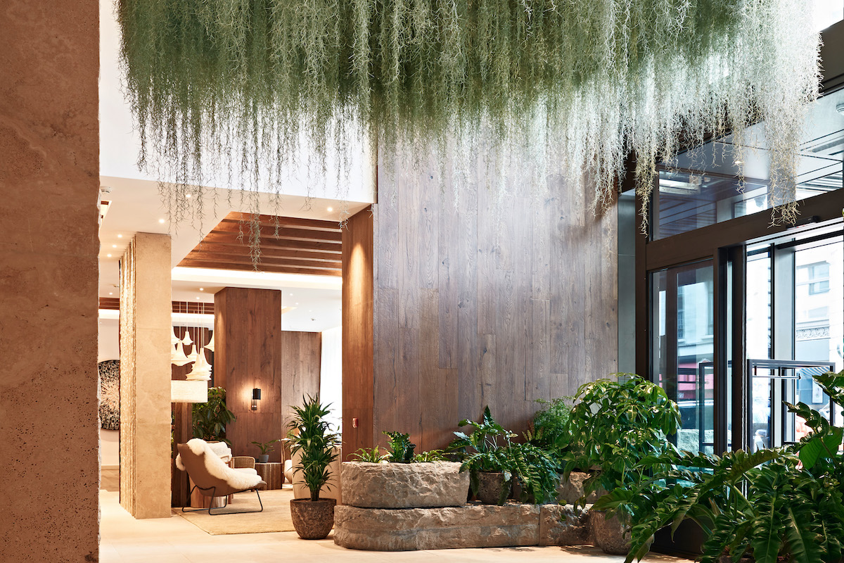 Lobby inside 1 Hotels Mayfair, which features a large living chandelier