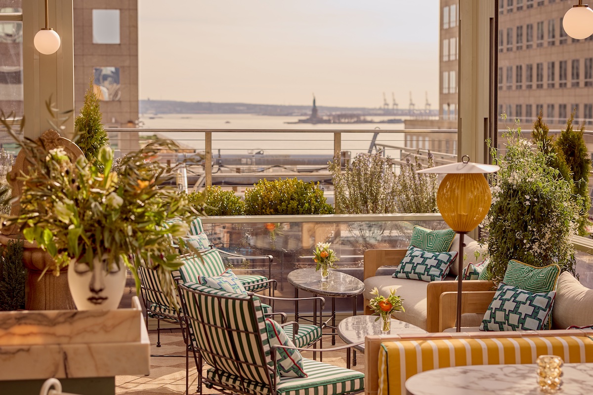 Interiors of rooftop at Conrad New York Downtown, with summer inspired style