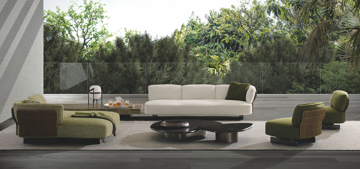 Saki Outdoor furniture setting with green and cream furniture on decking
