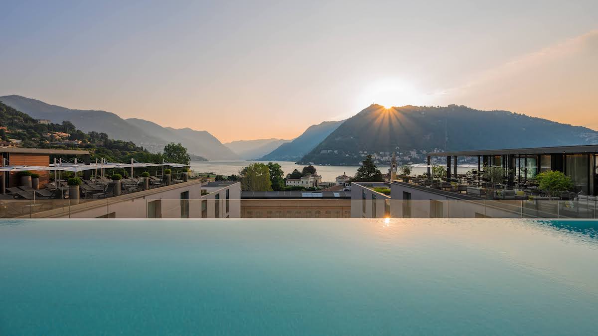 Infinity pool at Hilton Hotel Lake Como, overlooking lake and mountains