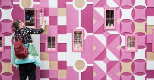 Clerkenwell Design Week - woman looking into pink boxes