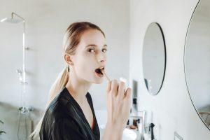 woman brushing teeth