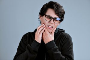Man experiencing dental pain